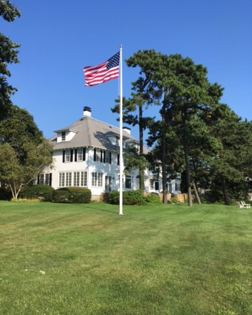 Zeus Flagpoles Aura Series in a residential yard